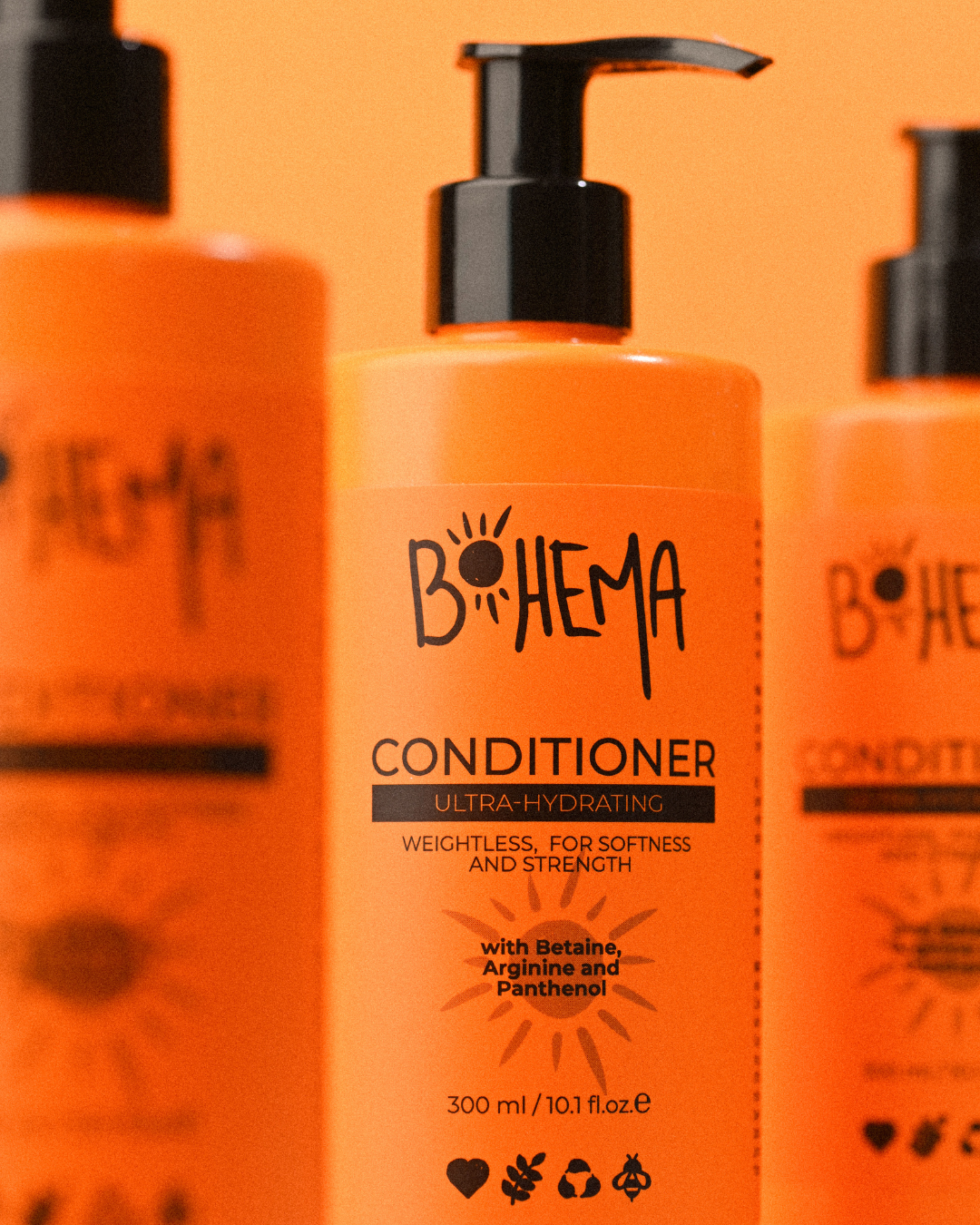 Orange conditioner bottle with 'Bohema' branding on an orange background