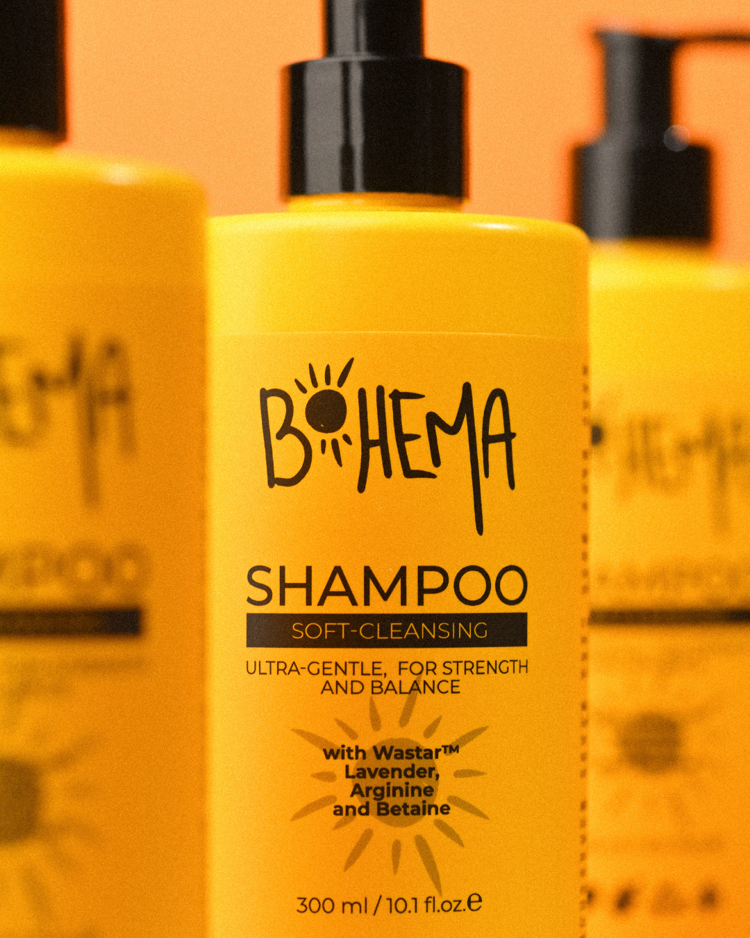 Yellow shampoo bottle with 'Bohema' branding on an orange background